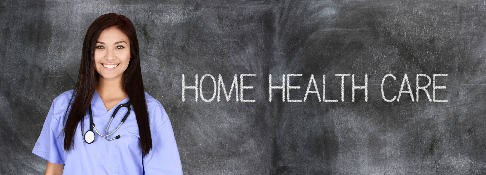Full indoor shot of a woman in a light purple scrubs uniform, smiling, with a stethoscope around her neck. The background is a dark gray chalkboard-like surface, and the words “HOME HEALTH CARE” are written in a light, chalky white font across the mid-ground.