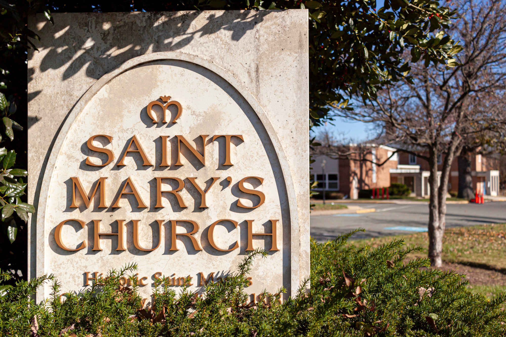 Full outdoor shot of a sign for Saint Mary's Church. Saint Mary's Church is the oldest church that is still in use in Rockville. This is a historic Catholic church close to town center.